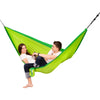 Two people enjoying an outdoor hammock
