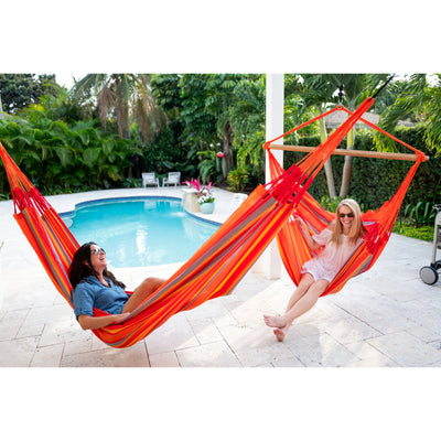 Toucan hammock and chair hammock outdoors beside swimming pool