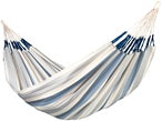 Striped hammock with blue and white pattern on a plain background