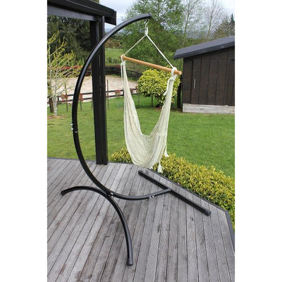 Freestanding hammock chair stand with white cotton Mexican hammock chair on deck