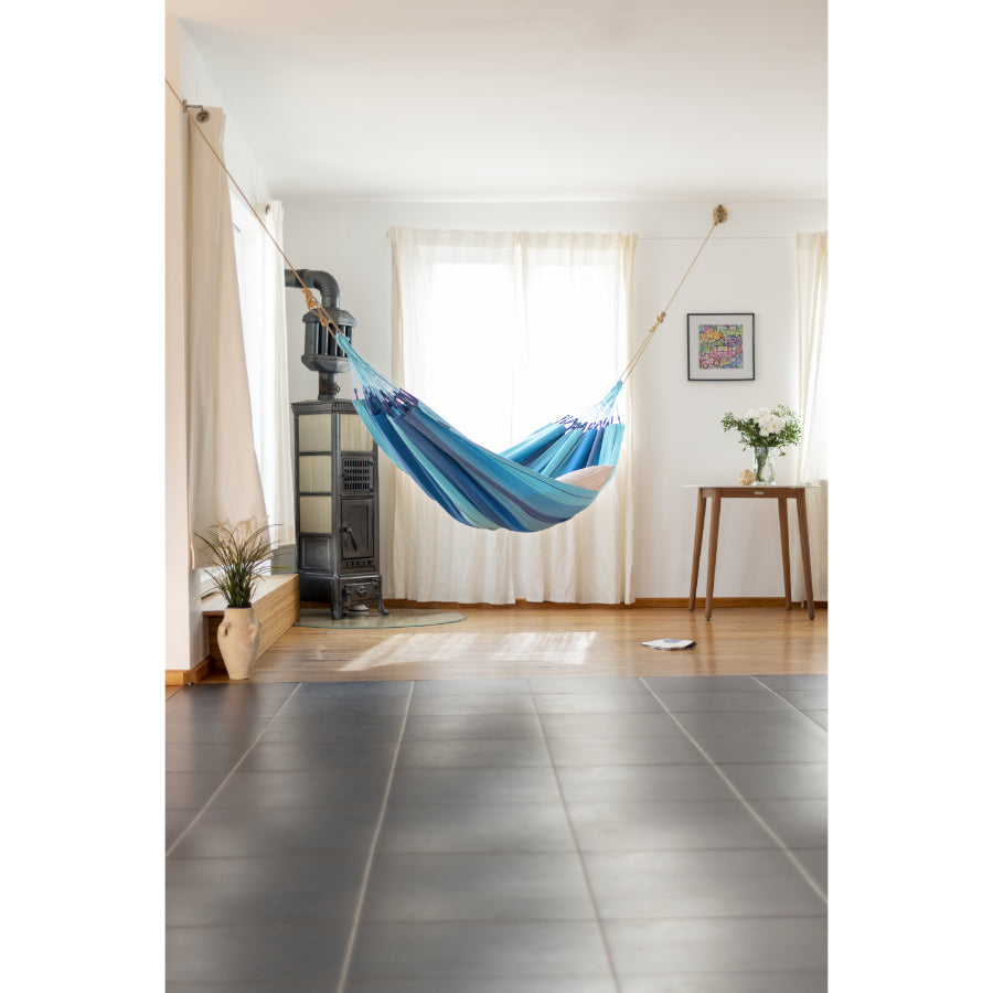 Indoor hung blue hammock