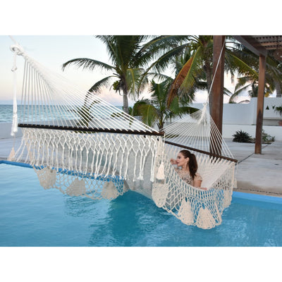 large Mexican hammock hanging over swimming pool