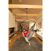 Father and son taking a nap in large hammock chair