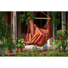 Woman relaxing in large hammock chair