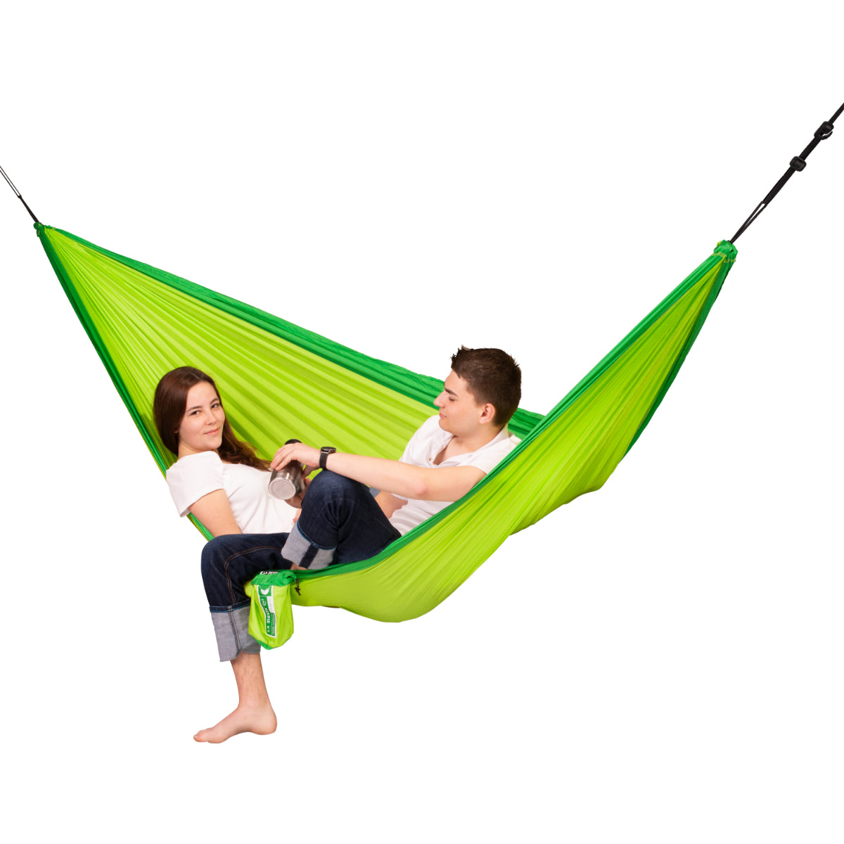 Two people enjoying an outdoor hammock