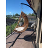 Chair hammock stand with hanging egg chair on balcony
