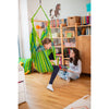 Child relaxing in small chair hammock