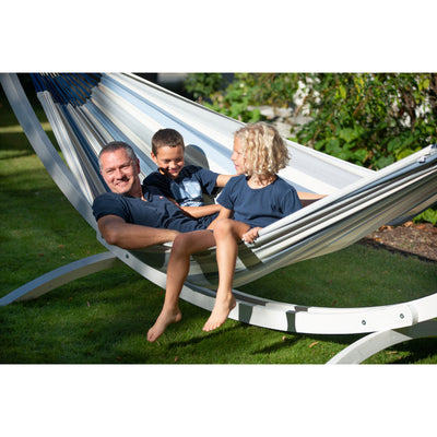 Man and kids enjoying time together in hammock