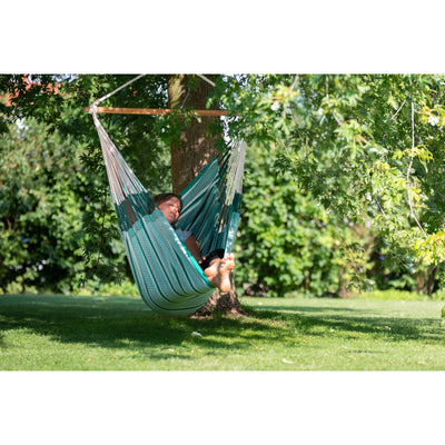 Chair hammock under tree outside