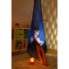 Child reading in blue hanging nest inside