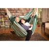Father and daugther talking in large hammock chair