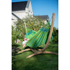 Green hammock on wooden stand