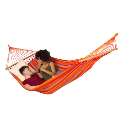 Two people in brightly coloured spreader bar hammock