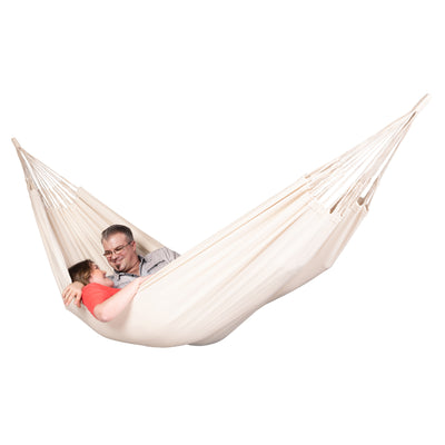couple relaxing in white hammock together