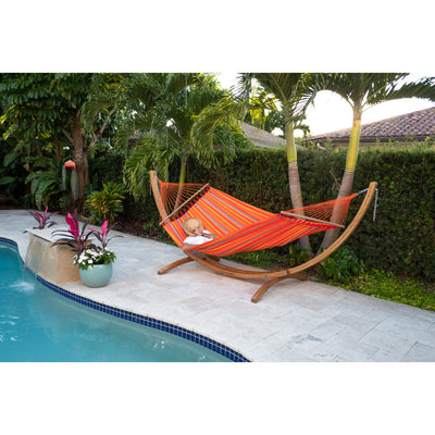 Spreader hammock in wooden hammock stand by pool