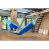 Mother and son reading book in hammock